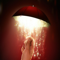 hand holds a bright umbrella with a magical glow